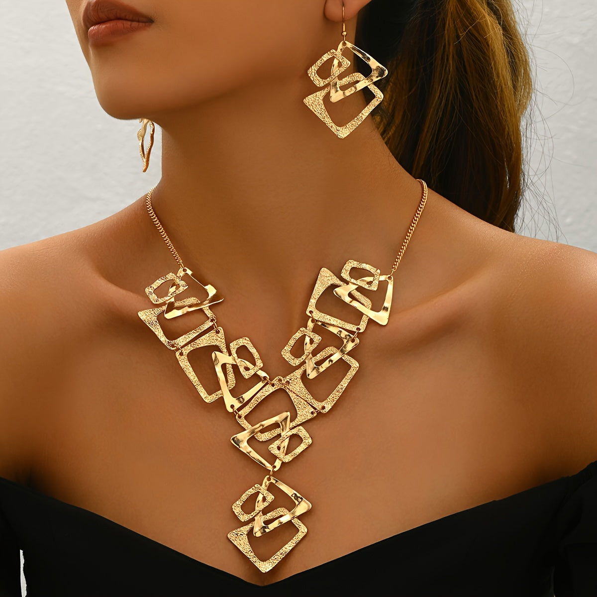 A Three-Piece Set Featuring a Y-Shaped Necklace And Earrings, Designed with Irregular Geometric Shapes Like Triangles, Rectangles, And Trapezoids