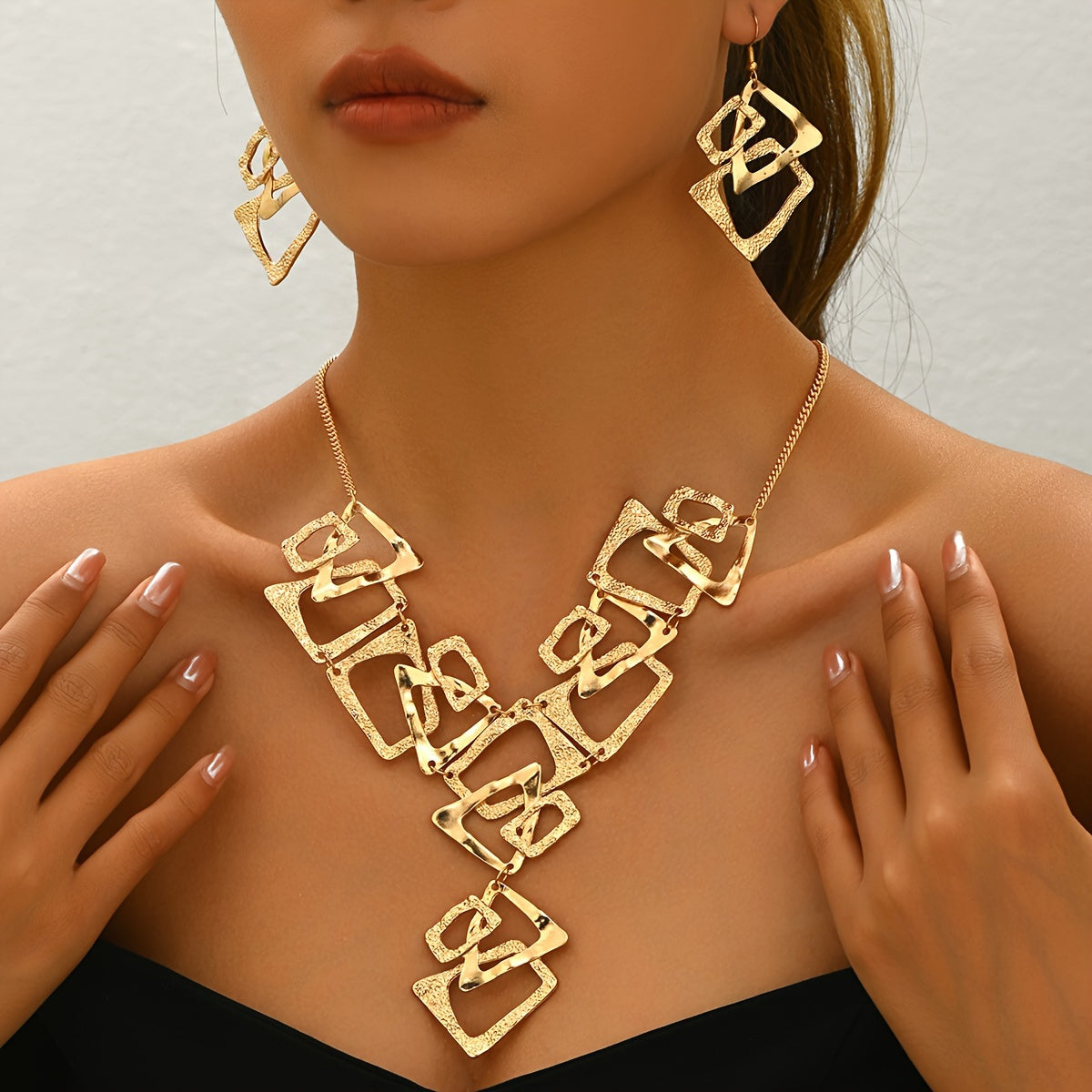 A Three-Piece Set Featuring a Y-Shaped Necklace And Earrings, Designed with Irregular Geometric Shapes Like Triangles, Rectangles, And Trapezoids
