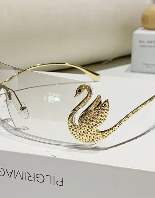 Load image into Gallery viewer, New Fashion Women Oversized Rimless Sunglasses Luxury Brand Swan Shaped Sun Glasses Trendy Large Frame Sun Glasses UV400
